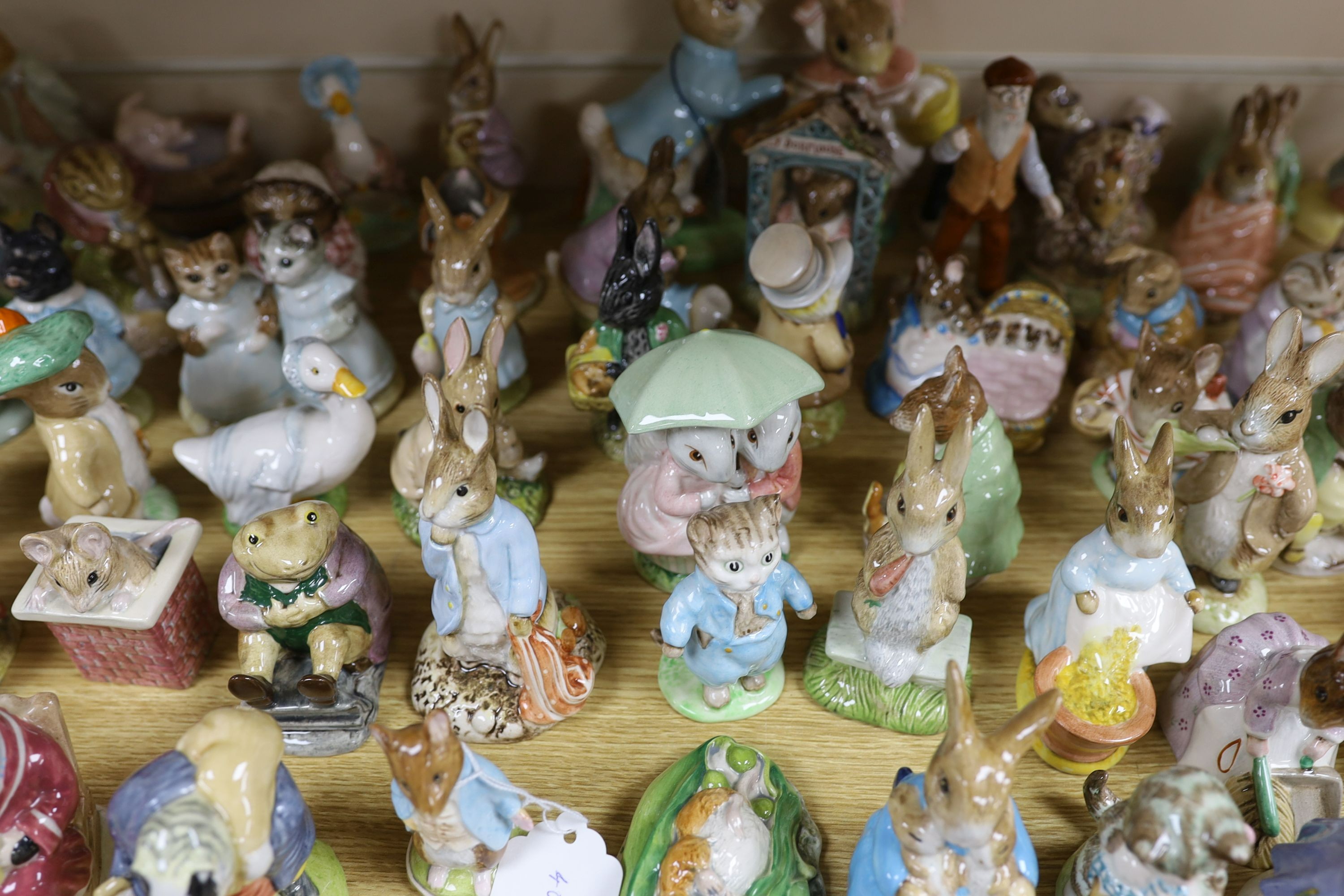 A large collection of Beatrix Potter ceramic figures by Royal Doulton, Beswick and Royal Albert, to include ‘Sir Isaac Newton’ and ‘Mr McGregor’